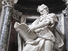 a men reads a book statue